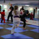 Preteens class working on their front kick