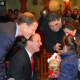 U.S. Sens. Richard Blumenthal and Chris Murphy greet Hanan and Lian, ages 5 and 8, at the Olive Tree in Milford on Friday. The girls and their mother were initially denied entry to the U.S. due to President Donald Trump's travel ban.
