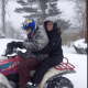 Danbury residents Theresa Wiblishauser and Michael Stuart riding in the snow