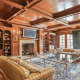 The wood-paneled living room and library at 9 Terrace Circle in Armonk combines elegance and comfort.