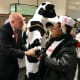 Franchise owner Archer Bullock welcomes one of the first customers early Thursday at the new Chick-Fil-A in Norwalk.
