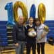 Saddle Brook's Cherie Smedile celebrates her 1,000th career point with her parents.