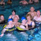 NCJW volunteers and swimmers (individuals with multiple sclerosis) take part in therapeutic exercise in the JCC pool.