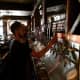 A bartender downloads some microbrew from one of the 90 taps at The Shepherd & The Knucklehead in Haledon.