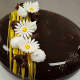 This chocolate sponge cake features dark chocolate mousse, hazelnut crunch and a passion fruit cream.
