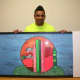 Anthony Martinez of White Plains displays a piece of art he created when he formerly lived at Abbott House in Irvington.