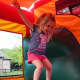 Bounce houses will be one of the Family Fund Day features -- as well as a rock wall, face painters and a dunk tank. [not a local photo]