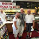 Bill Clinton poses for a photo at Lange's Little Store & Delicatessen in Chappaqua.