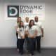 Sam Hopkins, back row, right, and Patrick Buckley, back row, middle, stand with their staff at Dynamic Edge PhysioTherapy in Wilton.