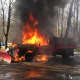 A dump truck is shown engulfed in flames in Monroe.
