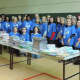 NFEP members and books that will be distributed free to Norwalk students as part of the "First Book" initiative.