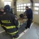 Firefighters practice their skills with power tools.