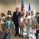 From left: Girl Scouts Katie Lopez, Melanie Valdes, Gaita Cisse (in front of her), Angelica DeDominicis, Kayla Michaud, Cecilie Johnsrud, and Tristen Connelly pose with U.S. Sen. Richard Blumenthal. 
