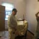 Some menbers of the Knights of Columbus get to work painting one of the bedrooms at the Malta House.