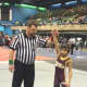 Nicky Singer of the Norwalk Mad Bulls gets his arm raised in victory after finishing third at Eastern Nationals.