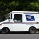 Queens Postal Workers Charged After Fraud Evidence Discovered In Hotel, Feds Say