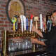 Bartender Michael Roundtree pours a glass of Sam Adams Oktoberfest last night at Jersey Boys in New Milford.