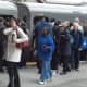 Train riders jam the platform at the Stamford station on Monday morning.