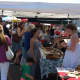 Shoppers browse the stalls at the PopShop Market in Fairfield Saturday afternoon. 