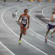 Angela Saidman (left) of the Wilton Running Club competes at the Junior Olympics.