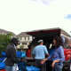 Volunteers with Norwalk-based Community Plates make food deliveries in big blue bins.