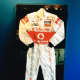 A racing suit worn by a Le Mans driver was one of the challenging framing pieces for Tom Geary.