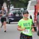 Kim Addis of Dobbs Ferry (201) races in the Labor Day 5K.