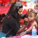 A local girl gets her face painted at Yonkers Riverfest. 