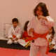A young karate student demonstrates a kata.