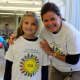 Cider Mill fourth-grader Jenna Kirincich, pictured with Vice Principal Catherine OKeefe, designed the winning T-shirts for this year's Walkathon.