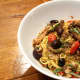 Spaghettini with baby octopus, olives, pear tomatoes and seasoned bread crumbs ($23). 