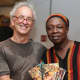 Phil Straus, Margaret Harris, and the leader of the Refugee All-Stars in Sierra Leone. Photo credit: Rick Wilson
