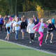 Students and staff from Wilton's Cider Mill School hit the track at Wilton High School Wednesday morning for the fourth annual Cider Mill Walkathon.