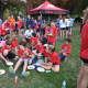 Runners from the New Canaan Running Club relax after Wednesday's race.