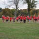 Members of the New Canaan Running Club stretch prior to the race.