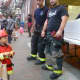 Dobbs Ferry firefighters greet the next generation of firemen at the village's Halloween celebration.