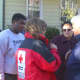 Tamara Garcia-Sanchez, whose home was damaged by the fire, speaks to a Red Cross volunteer. 