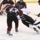 A player on the Harvey School hockey team glides toward the net.