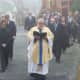 Rev. Eric Cosentino leads the procession at James Ferrari's funeral in Montrose. 