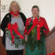 Pound Ridge Garden Club president Annie Thom, left, and Amanda Sutton, chair of the holiday decorating effort, display swags. 