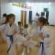 Two young martial artists spar at Kenshikai Karate.