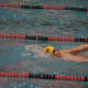 Jake Kealy swims in the backstroke for the Wahoos.
 