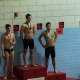 Wilton Wahoosswimmer Stephen Holmquist receives his gold medal after winning and setting a new pool record at Wesleyan University Pool in the 400 individual medley.
