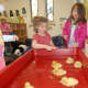 Saint Luke's Parish School students taking care of the ducklings.