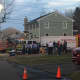Hazmat and fire crews set up near a neighbor's house on Clinton Street in Fairfield on Monday evening. 