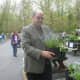 Ossining Mayor William Hanauer poses with some of his favorite plants at Teatown's annual plant sale. 