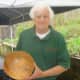 Charles Lazarus shows off one of his handcrafted bowls at Teatown's annual plant sale.