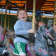 6-year-old Patrick Calabro, a Darien, Conn., resident, on a carousel at the carnival.