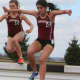Stephanie Benko, left, of New Canaan won the Patriot League championship in the steeplechase.