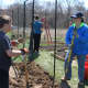 Volunteer Doni Wisdom (right) stops to chat with Boy Scout Christopher Lanni as they work at Graces Hill Farm, a new community garden at Our Saviours Lutheran Church in Fairfield last year.
